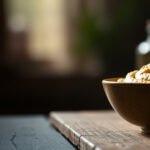 Bowl of hummus with vegetables, exploring keto-friendly options and carb content.